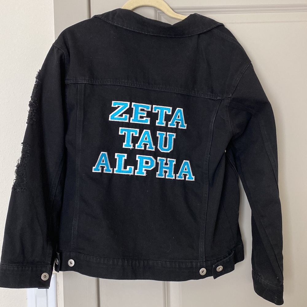 Black distressed Zeta Tau Alpha denim jacket